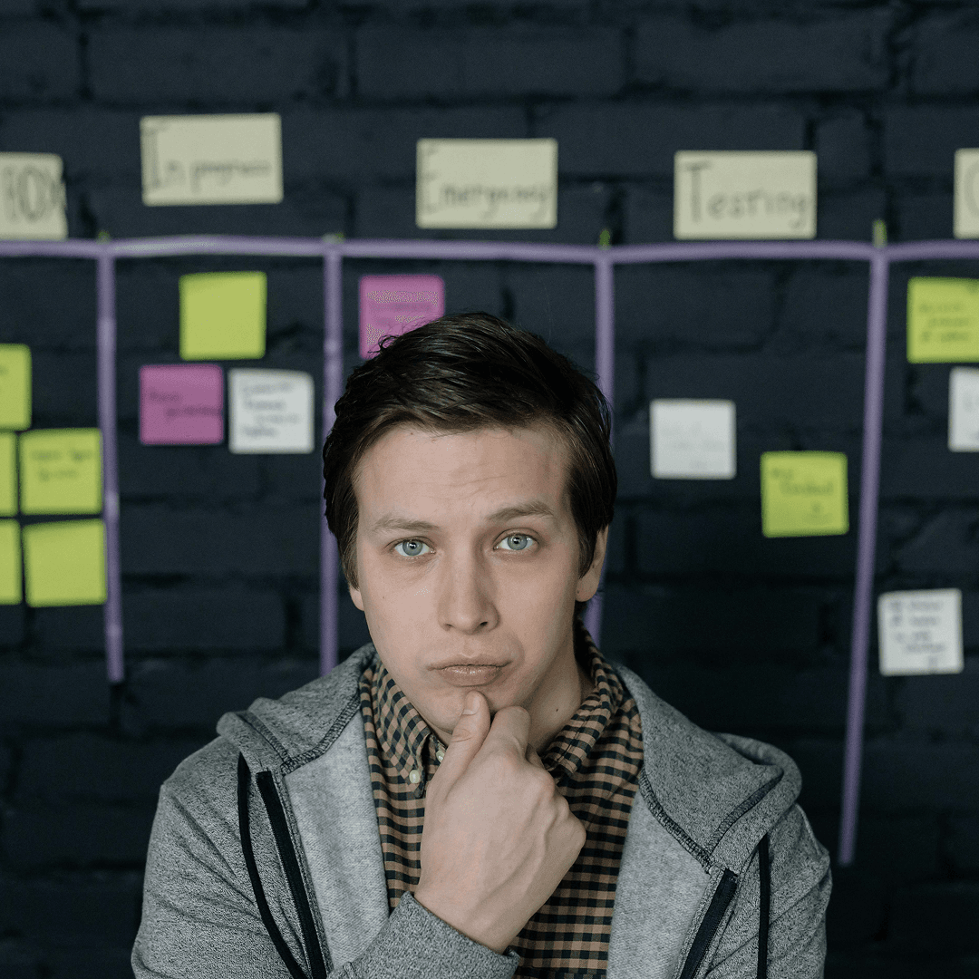 guy standing in front of a backlog